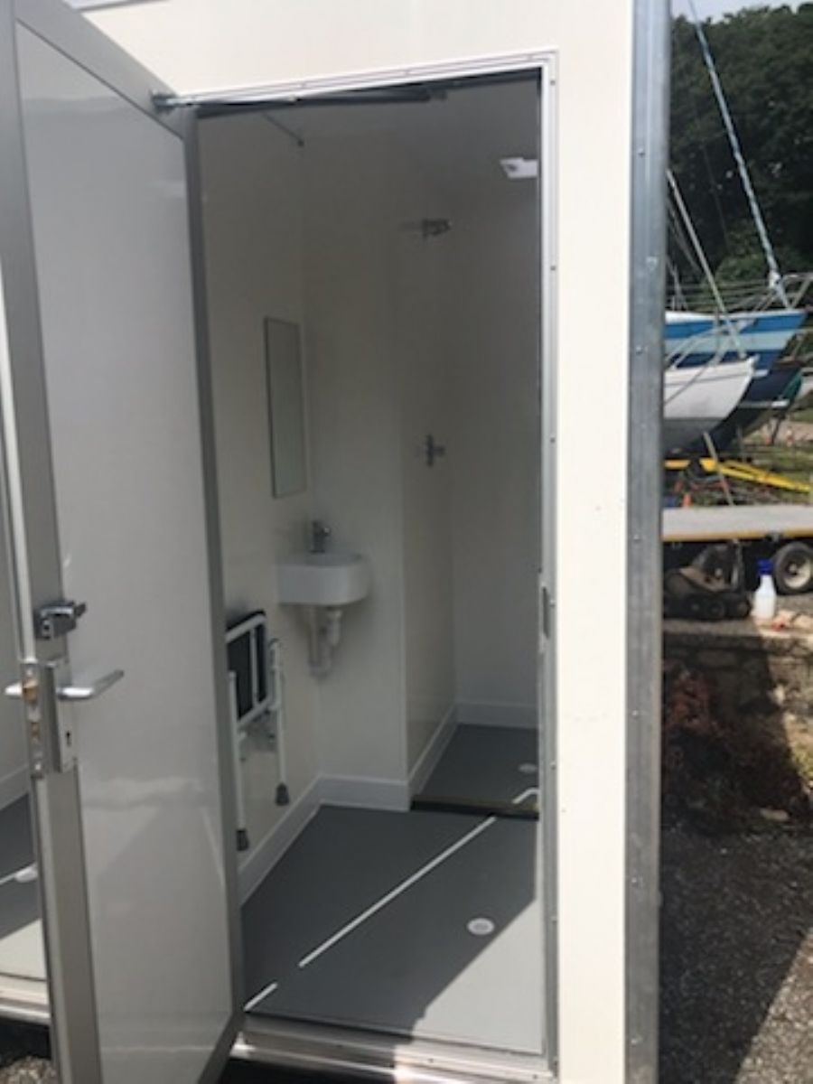 Shower unit with toilet